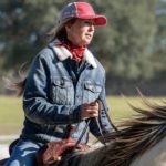 Cheyenne Wimberley loping a grey horse