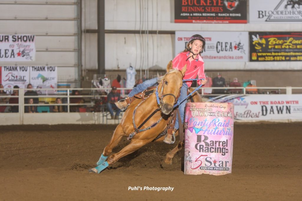 Riley Creech turning a barrel on her horse Jewel