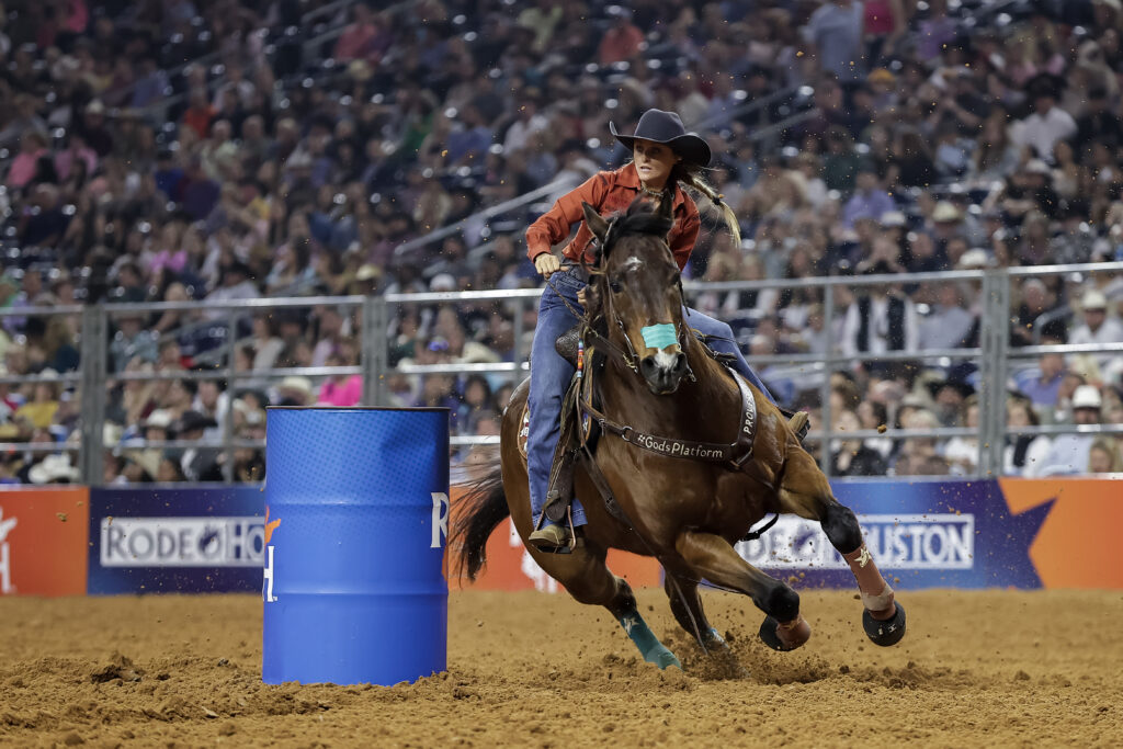 Stevi Hillman turns a barrel on her horse Truck at RodeoHouston.