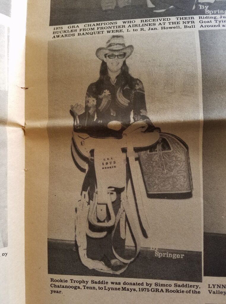 Lynne Mays with her 1975 barrel racing rookie of the year trophy saddle