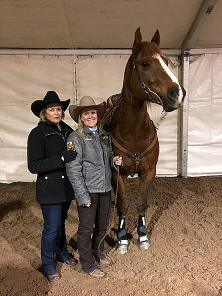Renee Ward and Kylie Weast pose with horse.