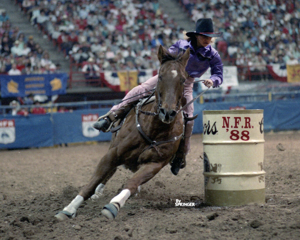 11-year-old barrel racer turns a barrel at the National Finals Rodeo.